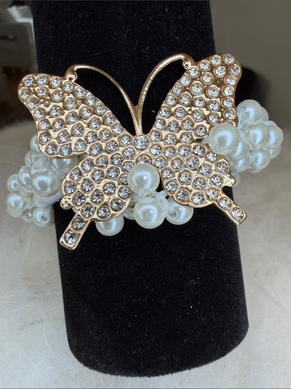 NWT Pearls and rhinestones stretch braclet. Gold tone butterfly 1 1/2” X 1 1/2”